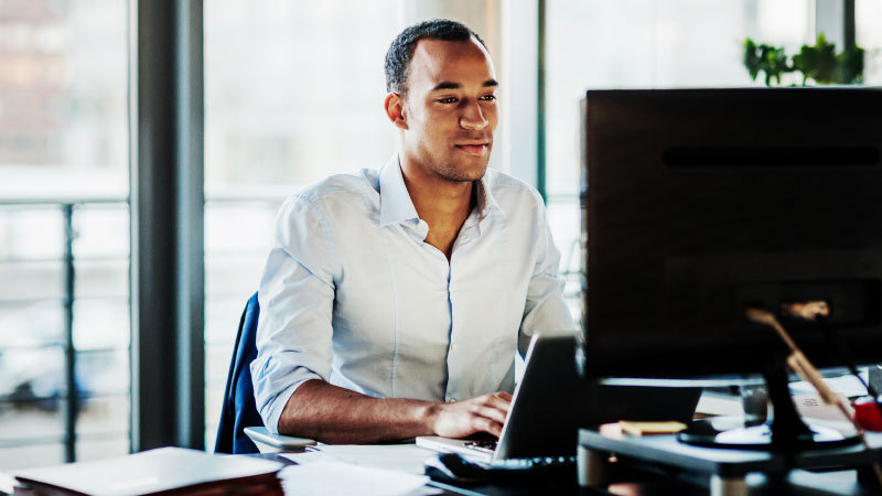 Man sitting at a computer desk